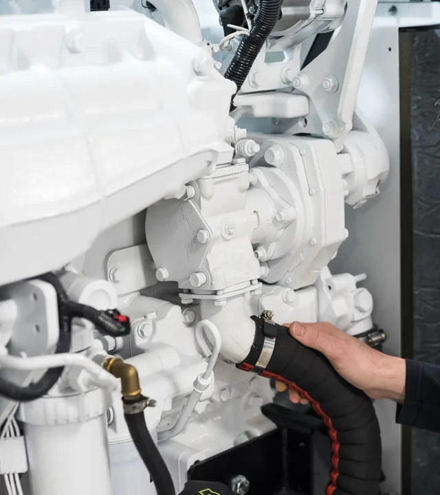 An engineer inspecting a yacht’s engine